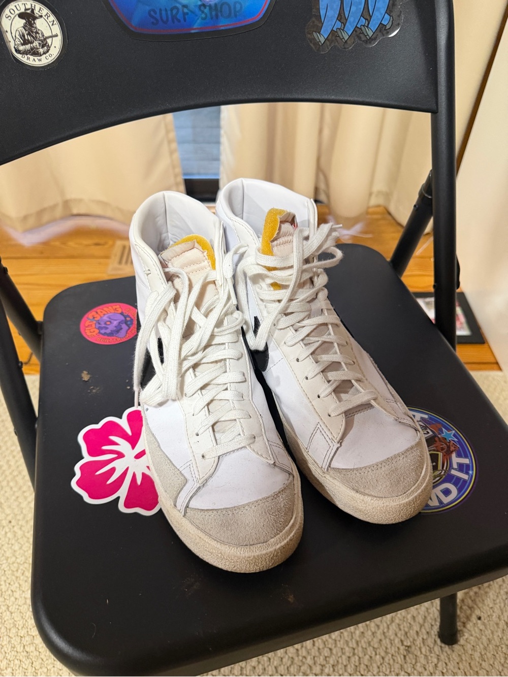 Nike White High-Top Sneakers with Black Swoosh and Yellow Tongue Accents